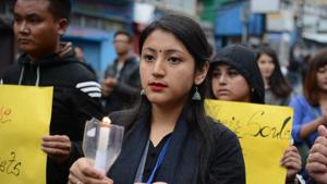 Supporters of Gorkha Janmukti Morcha (GJM) hold candles as they take part in a peace march as well as to pay respect to those killed in clashes with police during an indefinite strike called by the GJM, in Darjeeling on June 19, 2017.(AFP) Supporters of Gorkha Janmukti Morcha (GJM) hold candles as they take part in a peace march as well as to pay respect to those killed in clashes with police during an indefinite strike called by the GJM, in Darjeeling on June 19, 2017.(AFP)