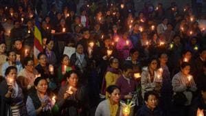 Hundreds take part in a vigil to pay respects to those killed in clashes with police during an indefinite strike in Darjeeling on June 19, 2017. Protesters on June 18 paraded with coffins containing the bodies of two men they claimed were killed in clashes with Indian security forces in Darjeeling, as the hill resort reels from separatist unrest.(AFP Photo) Hundreds take part in a vigil to pay respects to those killed in clashes with police during an indefinite strike in Darjeeling on June 19, 2017. Protesters on June 18 paraded with coffins containing the bodies of two men they claimed were killed in clashes with Indian security forces in Darjeeling, as the hill resort reels from separatist unrest.(AFP Photo)