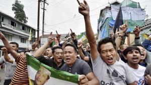 Darjeeling: Gorkha Janamukti Morcha supporters shout slogans at a protest rally during their indefinite strike in Darjeeling on Monday.(PTI) Darjeeling: Gorkha Janamukti Morcha supporters shout slogans at a protest rally during their indefinite strike in Darjeeling on Monday.(PTI)