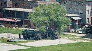 Bullet proof vehicles stationed in the premises of Delhi Public School (DPS) where two militants were holed up during an encounter with the security forces at Pantha Chowk in Srinagar on Sunday.(PTI Photo) Bullet proof vehicles stationed in the premises of Delhi Public School (DPS) where two militants were holed up during an encounter with the security forces at Pantha Chowk in Srinagar on Sunday.(PTI Photo)