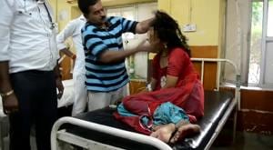 In the video circulating on social media, a doctor is seen pulling a woman patient (face blurred to protect identity) by her hair and then slapping her, allegedly to exorcise her of evil spirits, at the Barmer district hospital in Rajasthan.(Video Grab) In the video circulating on social media, a doctor is seen pulling a woman patient (face blurred to protect identity) by her hair and then slapping her, allegedly to exorcise her of evil spirits, at the Barmer district hospital in Rajasthan.(Video Grab)