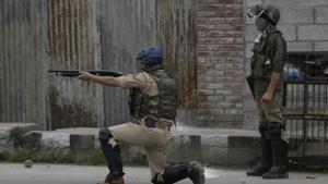 A paramilitary personnel fires a pellet gun during a protest after in Srinagar.(AP FILE PHOTO) A paramilitary personnel fires a pellet gun during a protest after in Srinagar.(AP FILE PHOTO)
