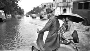 A family soaks in the rain at Minto Bridge. Monsoon used to be the time for picnics, family and cultural gatherings and feast for Delhiites.(HT file photo) A family soaks in the rain at Minto Bridge. Monsoon used to be the time for picnics, family and cultural gatherings and feast for Delhiites.(HT file photo)