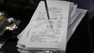 A bill is clumped together with others at a restaurant with the new Goods and Services Tax (GST) added to it, in Mumbai.(AP Photo) A bill is clumped together with others at a restaurant with the new Goods and Services Tax (GST) added to it, in Mumbai.(AP Photo)