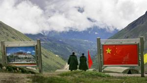 Chinese army officers on the Chinese side of the international border at Nathula Pass in Sikkim. (AP Photo/Gurinder Osan)(AP) Chinese army officers on the Chinese side of the international border at Nathula Pass in Sikkim. (AP Photo/Gurinder Osan)(AP)
