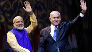 Prime Minister Narendra Modi with Israeli Prime Minister Benjamin Netanyahu at the Community Reception Programme, in Tel Aviv, Israel on Wednesday.(PTI Photo) Prime Minister Narendra Modi with Israeli Prime Minister Benjamin Netanyahu at the Community Reception Programme, in Tel Aviv, Israel on Wednesday.(PTI Photo)