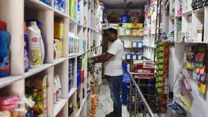 An Indian shopkeeper arranges goods on a shelf inside his shop in New Delhi on August 3, 2016. Finance Minister Arun Jaitley said India was on the cusp of its biggest tax reform since independence ahead of a vote in parliament later August 3 on a new national sales tax. The Goods and Services Tax (GST) will replace a patchwork of central and state levies on goods and services and is one of Prime Minister Narendra Modi's biggest reforms since taking power in May 2014. / AFP PHOTO / SAJJAD HUSSAIN(AFP File Photo) An Indian shopkeeper arranges goods on a shelf inside his shop in New Delhi on August 3, 2016. Finance Minister Arun Jaitley said India was on the cusp of its biggest tax reform since independence ahead of a vote in parliament later August 3 on a new national sales tax. The Goods and Services Tax (GST) will replace a patchwork of central and state levies on goods and services and is one of Prime Minister Narendra Modi's biggest reforms since taking power in May 2014. / AFP PHOTO / SAJJAD HUSSAIN(AFP File Photo)
