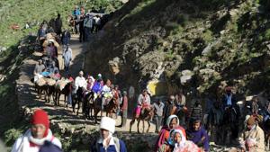 Pilgrims begin their journey from Baltal base camp to the Amarnath cave shrine. Seven people were killed when terrorists attacked a bus carrying pilgrims on Monday night in Jammu and Kashmir’s Anantnag district.(AFP file photo) Pilgrims begin their journey from Baltal base camp to the Amarnath cave shrine. Seven people were killed when terrorists attacked a bus carrying pilgrims on Monday night in Jammu and Kashmir’s Anantnag district.(AFP file photo)