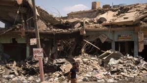 A man walks along a damaged street in west Mosul, a few days after the government's announcement of liberation of the embattled city from Islamic State.(AFP) A man walks along a damaged street in west Mosul, a few days after the government's announcement of liberation of the embattled city from Islamic State.(AFP)