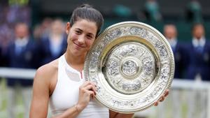 Spain’s Garbine Muguruza poses with the trophy as she celebrates winning the Wimbledon women’s singles final against Venus Williams on Saturday. Catch highlights of the Wimbledon women’s singles final between Garbine Muguruza and Venus Williams here.(Reuters) Spain’s Garbine Muguruza poses with the trophy as she celebrates winning the Wimbledon women’s singles final against Venus Williams on Saturday. Catch highlights of the Wimbledon women’s singles final between Garbine Muguruza and Venus Williams here.(Reuters)