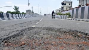 Forget patch work with bitumen, the municipal corporation (MC) has failed to even fill potholes with soil and gravel to provide some relief to the commuters this rainy season.(Gurminder Singh/HT) Forget patch work with bitumen, the municipal corporation (MC) has failed to even fill potholes with soil and gravel to provide some relief to the commuters this rainy season.(Gurminder Singh/HT)