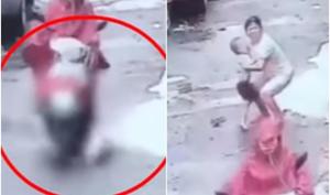 The CCTV footage shows the boy running out in front of the woman who rides over him and races away from the scene (Youtube/Screengrab) The CCTV footage shows the boy running out in front of the woman who rides over him and races away from the scene (Youtube/Screengrab)