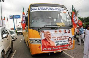 A school bus ferrying people to a BJP rally to welcome Amit Shah in Rohtak on Wednesday.(HT File) A school bus ferrying people to a BJP rally to welcome Amit Shah in Rohtak on Wednesday.(HT File)