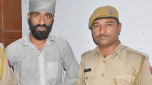 Mannu Punjabi (left) is wanted in cases of liquor smuggling and possession of illegal arms.(HT Photo) Mannu Punjabi (left) is wanted in cases of liquor smuggling and possession of illegal arms.(HT Photo)