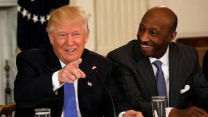 Merck & Co CEO Ken Frazier (right) listens to US President Donald Trump speak during a meeting with manufacturing CEOs at the White House in February 2017.(Reuters) Merck & Co CEO Ken Frazier (right) listens to US President Donald Trump speak during a meeting with manufacturing CEOs at the White House in February 2017.(Reuters)