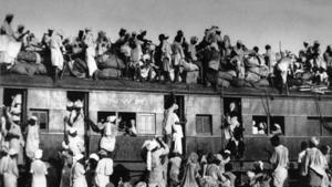 People migrating to Pakistan sit on the roof of an overcrowded coach railway train near New Delhi on September 19, 1947, a month after Partition.(AP Photo) People migrating to Pakistan sit on the roof of an overcrowded coach railway train near New Delhi on September 19, 1947, a month after Partition.(AP Photo)