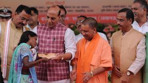 Adityanath and union home minister Rajnath Singh distributed certificates to farmers in keeping with the BJP’s assembly election promise.(Subhankar Chakraborty/HT PHOTO) Adityanath and union home minister Rajnath Singh distributed certificates to farmers in keeping with the BJP’s assembly election promise.(Subhankar Chakraborty/HT PHOTO)