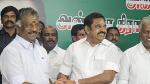 Panneerselvam and Palaniswami shake hands at the party headquarters after announcing merge of the AIADMK factions.(HT Photo) Panneerselvam and Palaniswami shake hands at the party headquarters after announcing merge of the AIADMK factions.(HT Photo)