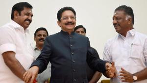 Tamil Nadu chief minister K Palaniswami (L) greets O Panneerselvam (R) after he was sworn in as the deputy chief minister in the presence of Governor CH Vidyasagar Rao (C) at Raj Bhavan in Chennai on Monday.(PTI) Tamil Nadu chief minister K Palaniswami (L) greets O Panneerselvam (R) after he was sworn in as the deputy chief minister in the presence of Governor CH Vidyasagar Rao (C) at Raj Bhavan in Chennai on Monday.(PTI)