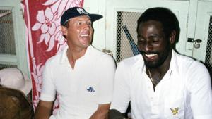 England and Yorkshire batsman Geoffrey Boycott (left) shares a joke with West Indies batsman Viv Richards in the dressing room in Antigua during the 1981 Test series between West Indies and England. Boycott triggered a racism storm with his comments on how the West Indians got knighthood(Getty Images)