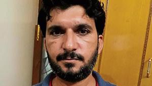 Son Anshul with a photo of journalist Ram Chander Chhatrapati and his local newspaper of May 30, 2002, carrying the rape report.(HT Photo) Son Anshul with a photo of journalist Ram Chander Chhatrapati and his local newspaper of May 30, 2002, carrying the rape report.(HT Photo)