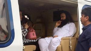 Dera Sacha Sauda chief Gurmeet Ram Rahim Singh was taken to a prison in Rohtak on Friday in a helicopter after being convicted of rape, which triggered rioting from his followers.(PTI photo) Dera Sacha Sauda chief Gurmeet Ram Rahim Singh was taken to a prison in Rohtak on Friday in a helicopter after being convicted of rape, which triggered rioting from his followers.(PTI photo)