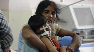 A mother holds her child inside encephalitis ward at BRD Medical Centre in Gorakhpur, on August 15.(HT File Photo) A mother holds her child inside encephalitis ward at BRD Medical Centre in Gorakhpur, on August 15.(HT File Photo)