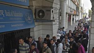 File photo of people waiting in a queue to withdraw money from an ATM in New Delhi in December 2016, a month after the government’s shock recall of high-value banknotes.(Ravi Choudhary/HT File Photo) File photo of people waiting in a queue to withdraw money from an ATM in New Delhi in December 2016, a month after the government’s shock recall of high-value banknotes.(Ravi Choudhary/HT File Photo)