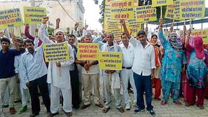 Villages protesting against BJP zila parishad chairman Balraj Kundu in Meham on Tuesday.(HT Photo) Villages protesting against BJP zila parishad chairman Balraj Kundu in Meham on Tuesday.(HT Photo)