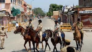 Horse-mounted police personnel patrol a locality during curfew in Jaipur.(PTI)