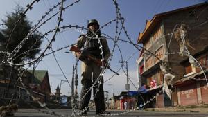 An Indian paramilitary soldier stands guard at a temporary check point during restrictions in Srinagar.(AP File Photo) An Indian paramilitary soldier stands guard at a temporary check point during restrictions in Srinagar.(AP File Photo)