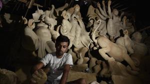 The idol makers gather in CR Park in south Delhi three months before Durga Puja. Their Durga idols go for anything between Rs 10,000 and Rs 1 lakh.(Vipin Kumar/HT Photo) The idol makers gather in CR Park in south Delhi three months before Durga Puja. Their Durga idols go for anything between Rs 10,000 and Rs 1 lakh.(Vipin Kumar/HT Photo)