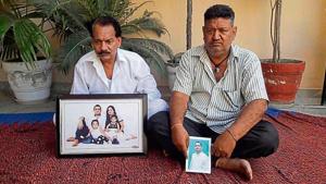 Family members holding the pictures of deceased Lalit and his missing uncle Talwinder Singh in SBS Nagar on Friday.(HT Photo) Family members holding the pictures of deceased Lalit and his missing uncle Talwinder Singh in SBS Nagar on Friday.(HT Photo)