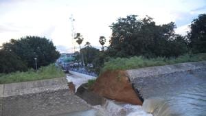 Nearly 20 feet of the wall of the main canal of the Bateswar Ganga Pump Nahar Yojana (BGPNY) breached during a trial on Tuesday.(HT Photo)