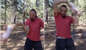 In a shocking video, a Ukrainian dad can be seen standing in a wooden area swirling his daughter like a rag doll. (Youtube/Screengrab) In a shocking video, a Ukrainian dad can be seen standing in a wooden area swirling his daughter like a rag doll. (Youtube/Screengrab)