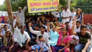 Residents protest the disappearance of a newborn from the gynaecology ward of PGIMS-Rohtak on the institute premises. Hospital director Dr Rakesh Gupta had resigned twelve days after the incident.(Manoj Dhaka/ HT Photo) Residents protest the disappearance of a newborn from the gynaecology ward of PGIMS-Rohtak on the institute premises. Hospital director Dr Rakesh Gupta had resigned twelve days after the incident.(Manoj Dhaka/ HT Photo)