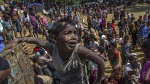 A Rohingya Muslim boy, who crossed over from Myanmar into Bangladesh, pleads with aid workers to give him a bag of rice near Balukhali refugee camp, Bangladesh, September 21(AP) A Rohingya Muslim boy, who crossed over from Myanmar into Bangladesh, pleads with aid workers to give him a bag of rice near Balukhali refugee camp, Bangladesh, September 21(AP)