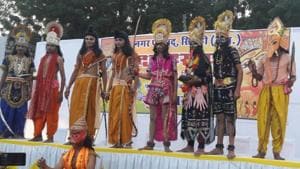 Members of the Ramleela party in Sirohi, which returned without burning the effigy of Ravana, seen on stage.(HT Photo)