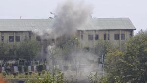Smoke billows out of the building where militants were believed to be hiding during an encounter with the security forces following their attack at a BSF camp, near the international airport in Srinagar on Tuesday.(Waseem Andrabi/HT Photo) Smoke billows out of the building where militants were believed to be hiding during an encounter with the security forces following their attack at a BSF camp, near the international airport in Srinagar on Tuesday.(Waseem Andrabi/HT Photo)