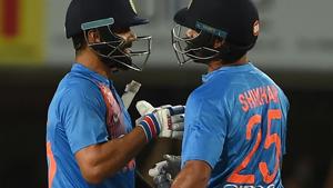 Indian cricket team captain Virat Kohli (L) and Shikhar Dhawan celebrate after beating Australia cricket team in the first T20I at The JSCA International Stadium in Ranchi on Saturday. Spinner Kuldeep Yadav led an inspired bowling effort to help India beat Australia by nine wickets in the rain-shortened first Twenty20 international.(AFP) Indian cricket team captain Virat Kohli (L) and Shikhar Dhawan celebrate after beating Australia cricket team in the first T20I at The JSCA International Stadium in Ranchi on Saturday. Spinner Kuldeep Yadav led an inspired bowling effort to help India beat Australia by nine wickets in the rain-shortened first Twenty20 international.(AFP)