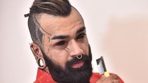 Karan, a Delhi-based professional tattoo artist, underwent a surgery called ‘sclera staining’ in which ink is permanently injected into the whites of the eyes.(Special arrangement/Karan) Karan, a Delhi-based professional tattoo artist, underwent a surgery called ‘sclera staining’ in which ink is permanently injected into the whites of the eyes.(Special arrangement/Karan)