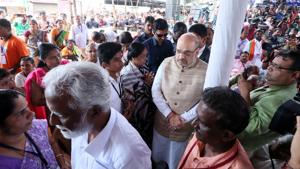 BJP president Amit Shah goes through a photo exhibition of pictures of party workers killed in political violence in north Kerala’s Kannur district.(HTPhoto) BJP president Amit Shah goes through a photo exhibition of pictures of party workers killed in political violence in north Kerala’s Kannur district.(HTPhoto)