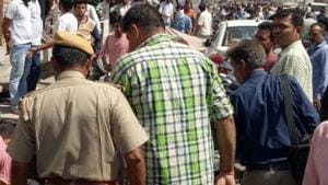 Police rescue a Muslim man who was brutally assaulted by a mob after being caught with a Hindu woman in a hotel room.(HT Photo) Police rescue a Muslim man who was brutally assaulted by a mob after being caught with a Hindu woman in a hotel room.(HT Photo)