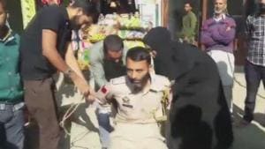 Videos and photos circulating on social media show residents catching the constable and tying him to a chair.(ANI Twitter) Videos and photos circulating on social media show residents catching the constable and tying him to a chair.(ANI Twitter)