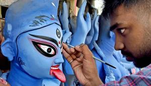 An artist gives finishing touches to a Goddess Kali idol ahead of Kali Puja. About 10,000 people, comprising Hindus and Muslims, in three villages in Assam’s Milan Chowk, celebrate Kali Puja together.(PTI) An artist gives finishing touches to a Goddess Kali idol ahead of Kali Puja. About 10,000 people, comprising Hindus and Muslims, in three villages in Assam’s Milan Chowk, celebrate Kali Puja together.(PTI)