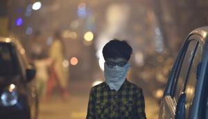A child protects his face amid heavy smog due to bursting of firecrackers despite the ban imposed by the Supreme Court to control the air pollution following Diwali celebrations in New Delhi on Thursday.(Raj K Raj/HT Photo) A child protects his face amid heavy smog due to bursting of firecrackers despite the ban imposed by the Supreme Court to control the air pollution following Diwali celebrations in New Delhi on Thursday.(Raj K Raj/HT Photo)