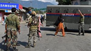 Security personnel at the scene of a grenade blast at Tral in Kashmir.(PTI) Security personnel at the scene of a grenade blast at Tral in Kashmir.(PTI)