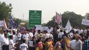 The protesters, around 300 in number, were holding placards and had tied black ribbons on their arms The protesters, around 300 in number, were holding placards and had tied black ribbons on their arms