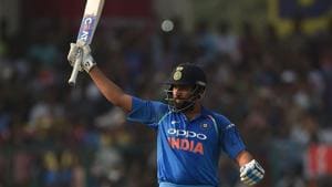 Indian cricketer Rohit Sharma raises his bat after hitting a century during the third ODI against New Zealand at Green Park in Kanpur on Sunday.(AFP) Indian cricketer Rohit Sharma raises his bat after hitting a century during the third ODI against New Zealand at Green Park in Kanpur on Sunday.(AFP)