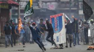 A Kashmiri protester holds a flag of Pakistan during a protest in Srinagar.(AP File Photo) A Kashmiri protester holds a flag of Pakistan during a protest in Srinagar.(AP File Photo)